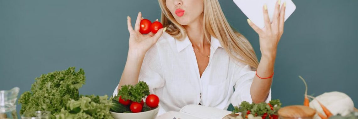 Vlogger promoting healthy eating with fresh vegetables on the table.